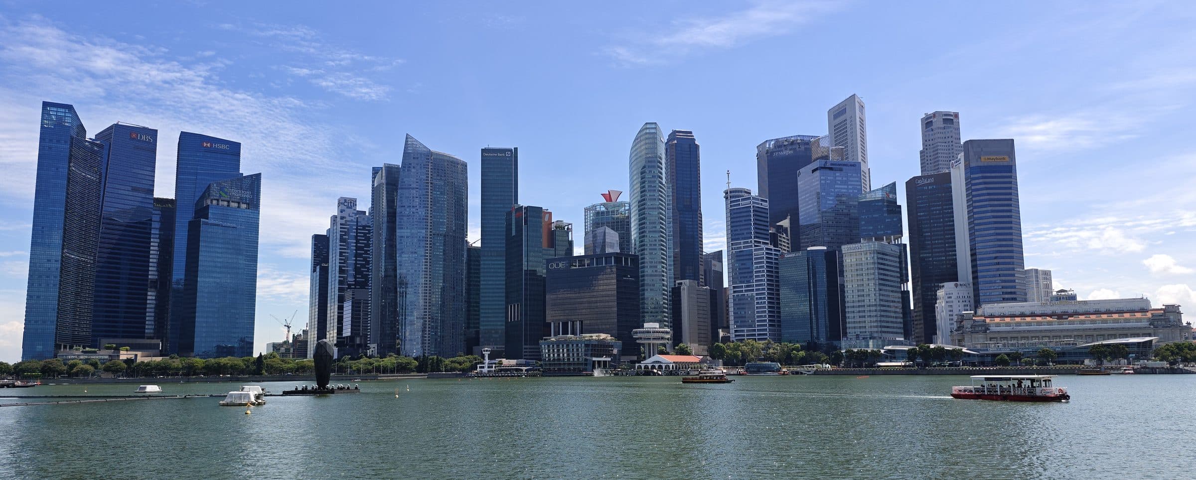 Office towers of the Singapore Central Business District seen from the waterfront on a clear day